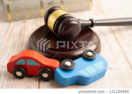 Car accident lawsuit and insurance, Judge hammer with car model. 131284988