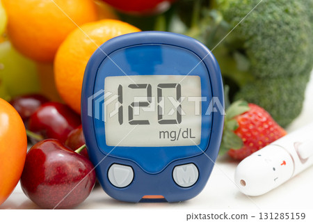 Glucose meter with vegetable and fruit for check sample blood sugar level to treatment diabetes. 131285159