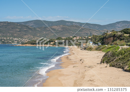 Spectacular view Golf at Sagone Corsica France beautyful sand Beach boats mountain village Tourism and vacations concept 131285375