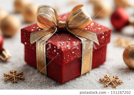 Packaging design. Classic Red Gift Box with Gold bow on white background. Christmas decor. Packaging design. Classic Red Gift Box with Gold bow on white background. Christmas decor. 131287202