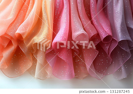 Attract premium clients. Diversity of bridal tulle with crystal embellishments is hanging on the wall. 131287245