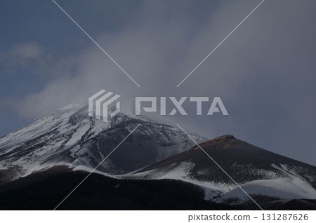 The various faces of snow-capped Mount Fuji and its side volcano, Mount Hoei 3 131287626