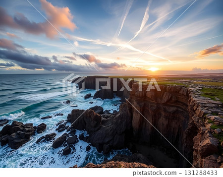 Dramatic Coastal Cliffs Under a Golden Sunset Sky Dramatic Coastal Cliffs Under a Golden Sunset Sky 131288433