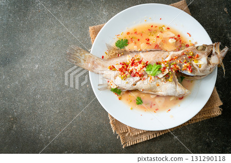 Steamed grouper fish with lime and chillies 131290118