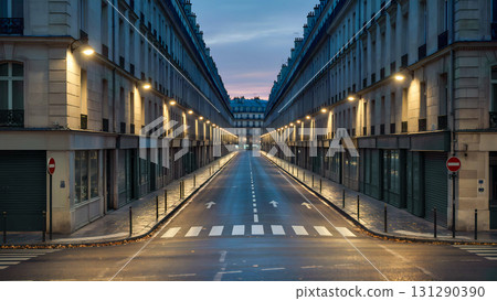 A long, symmetrical shot of an empty street in a classic European city (possibly Paris or similar). The street is framed by two rows of identical stone or stucco building facades with architectural el A long, symmetrical shot of an empty street in a classic European city (possibly Paris or similar). The street is framed by two rows of identical stone or stucco building facades with architectural el 131290390
