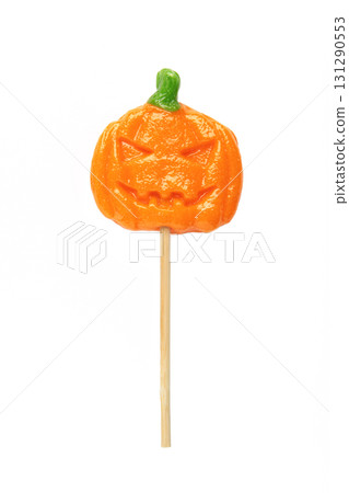 Halloween lollipop shaped like a pumpkin isolated on white background. Festive holiday treats for seasonal celebration Halloween lollipop shaped like a pumpkin isolated on white background. Festive holiday treats for seasonal celebration 131290553