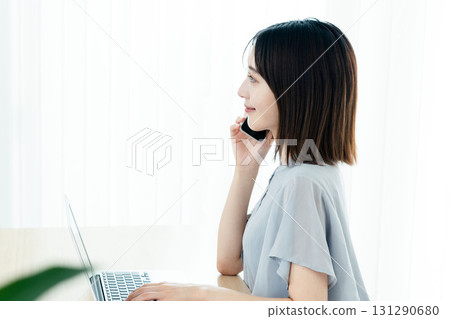 Woman calling in the office 131290680