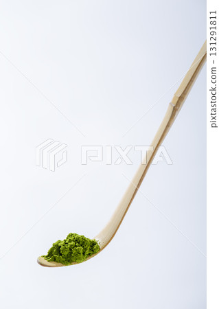 Matcha image: Tea spoon photographed against a white background Matcha image: Tea spoon photographed against a white background 131291811