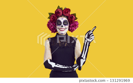 Portrait of happy woman with Catrina skull makeup on Halloween or Day of the Dead Portrait of happy woman with Catrina skull makeup on Halloween or Day of the Dead 131291969