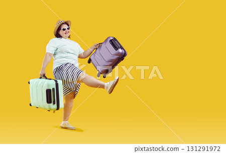 Funny plus size woman going on vacation, holding suitcases and walking on yellow background Funny plus size woman going on vacation, holding suitcases and walking on yellow background 131291972