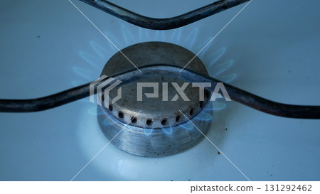 Gas burns with a blue flame on the gas burner of a gas stove. 131292462
