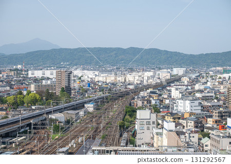 Odawara city in Kanagawa, Japan, Urban cityscape with railway tracks and residential buildings under clear sky Odawara city in Kanagawa, Japan, Urban cityscape with railway tracks and residential buildings under clear sky 131292567