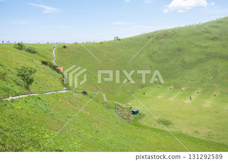 Omuro mountain in Ito, Shizuoka, Japan, Green hillside with walking path and people hiking on sunny day 131292589