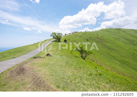 Omuro mountain in Ito, Shizuoka, Japan, Scenic hiking trail on green hill under blue sky with clouds 131292605