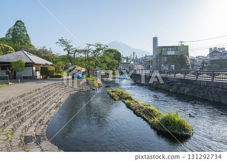 River flowing through urban area with greenery and Fuji mountain in background at Fujinomiya, Shizuoka, Japan, 131292734