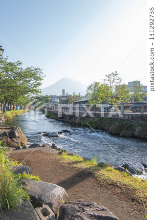 River flowing through park with mountain view in clear daylight at Fujinomiya, Shizuoka, Japan, 131292736