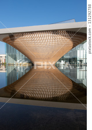 Mt. Fuji World Heritage Centre at Fujinomiya, Shizuoka, Japan, Modern architectural wooden lattice structure with water reflection outdoors 131292788