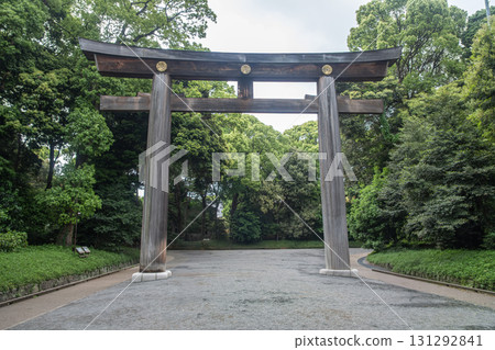 Traditional wooden torii gate in peaceful Japanese garden entrance at Meiji Jingu, Shibuya, Tokyo, Japan Traditional wooden torii gate in peaceful Japanese garden entrance at Meiji Jingu, Shibuya, Tokyo, Japan 131292841