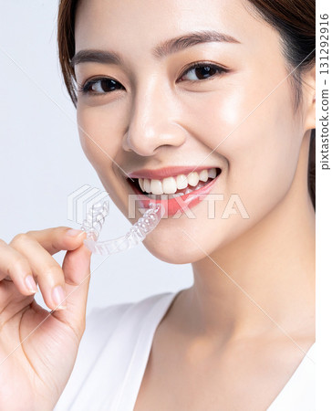 Young woman with a mouthpiece Young woman with a mouthpiece 131292916