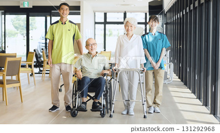 Asian caregiver supporting elderly people walking Asian caregiver supporting elderly people walking 131292968