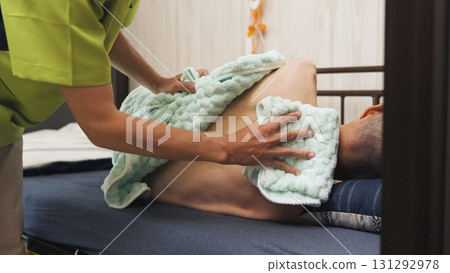 Asian caregiver bathing an elderly person Asian caregiver bathing an elderly person 131292978