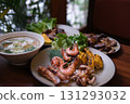 Grilled Seafood Feast on Outdoor Barbecue with Shellfish and Vegetables 131293032