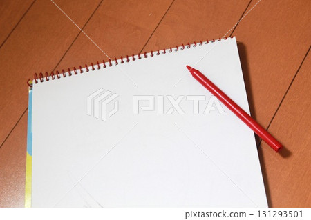 Red pencil and sketchbook 131293501
