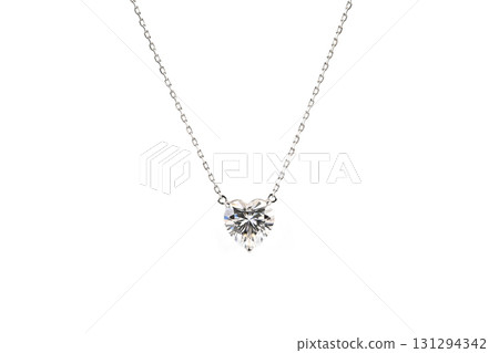 A heart shaped pendant with a diamond in the center 131294342