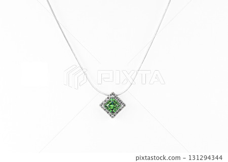 A green square gemstone pendant with a white chain 131294344