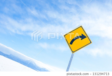 A simple landscape of the blue sky and right curve sign in Hokkaido in winter 131294713