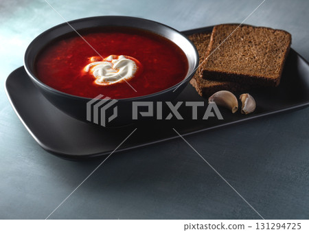 Traditional Ukrainian Borscht with Sour Cream, Rye Bread and Garlic 131294725