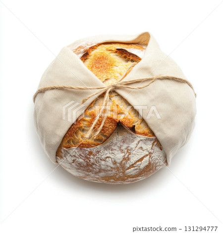 Freshly baked round bread styled in farmhouse aesthetic for food or packaging mockups 131294777