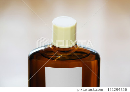 A bottle of hair growth product with a screw cap A bottle of hair growth product with a screw cap 131294836