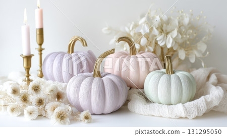 Blush pink and mint pumpkins styled with soft fabrics for modern spooky decor. 131295050