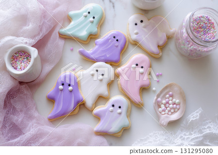 Whimsical pastel ghost cookies with pink, mint, and lilac icing on marble - ideal for Halloween-themed prints or baking blog visuals. Whimsical pastel ghost cookies with pink, mint, and lilac icing on marble - ideal for Halloween-themed prints or baking blog visuals. 131295080