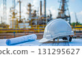 industry. helmet engineer and blueprint at factory outdoor site. 131295627