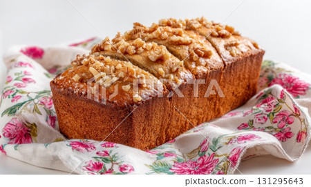 Golden banana bread with walnut topping and visible crumbs, isolated for printable bakery art. Golden banana bread with walnut topping and visible crumbs, isolated for printable bakery art. 131295643