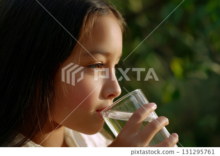 Soft-focus portrait of a healthy moment, combining innocence and outdoor calm in one frame 131295761