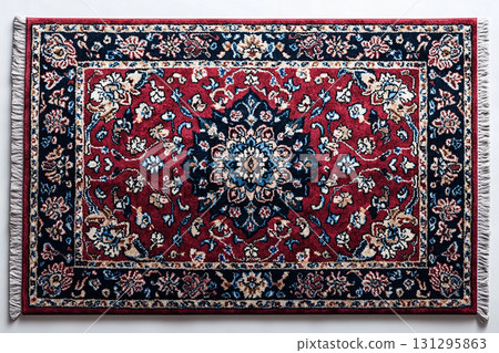 Handwoven Persian rug texture on a white background. Top view. 131295863