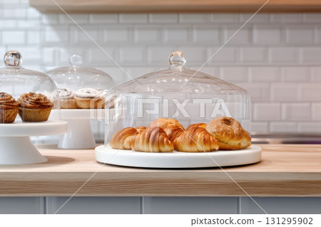Modern bakery counter with elegant pastry arrangement and minimal interior, ideal for cafe branding, product displays, and packaging design. 131295902