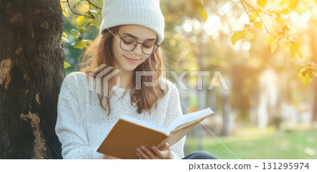 Christmas Morning with Teen Journaling by the Tree in Pajamas and Peaceful Light 131295974