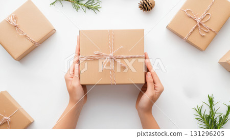 Hands opening mystery toy on white with clean visual style. Ideal for collectors and unboxing themes. 131296205