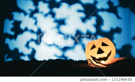 Jack-o'-lantern with bat shadows in spooky forest Jack-o'-lantern with bat shadows in spooky forest 131296430