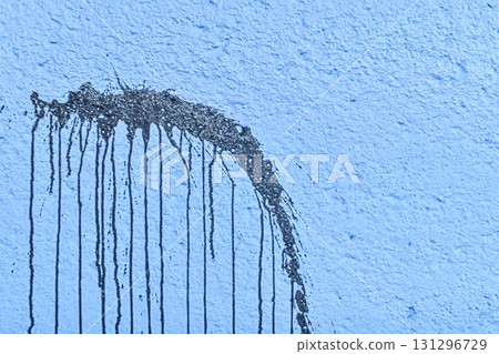 The coarse texture of a dark blue wall with a bold stain. The rough texture of a deep blue wall with an ink blot. The concept of background and textured surface. The coarse texture of a dark blue wall with a bold stain. The rough texture of a deep blue wall with an ink blot. The concept of background and textured surface. 131296729