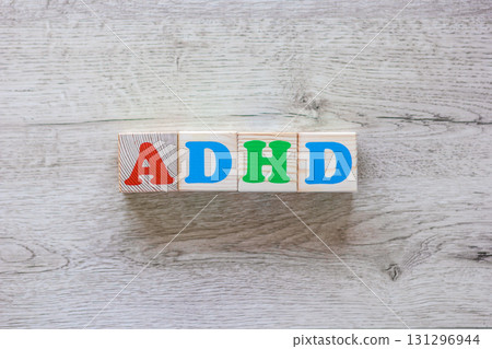 Abbreviation ADHD on wooden cubes with colorful letters Abbreviation ADHD on wooden cubes with colorful letters 131296944