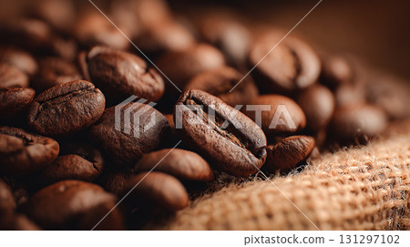 Close-up of roasted coffee beans, macro photography highlighting rich texture, brown color and aroma of freshly roasted coffee seeds, food background for cafe and coffee culture. Natural coffee. 131297102