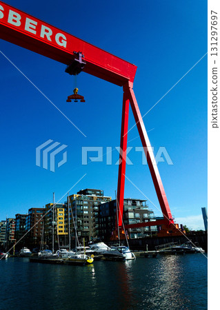 Eriksberg area on Hisingen in Gothenburg, former shipyard with big gantry crane near Alvsborg bridge, Sweden, sunny summer day Eriksberg area on Hisingen in Gothenburg, former shipyard with big gantry crane near Alvsborg bridge, Sweden, sunny summer day 131297697