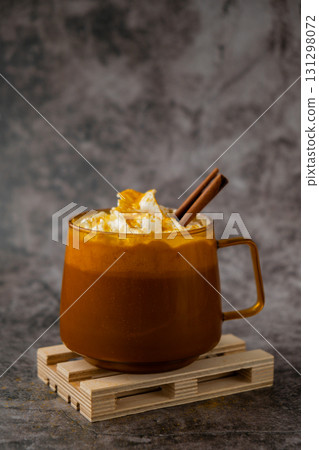 Autumn hygge Orange Cup of warm coffee autumn. Cozy fall still life dark background. Thanksgiving and Halloween holiday Autumn hygge Orange Cup of warm coffee autumn. Cozy fall still life dark background. Thanksgiving and Halloween holiday 131298072