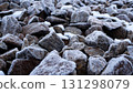 Many natural stones covered with frost on a cold winter day. 131298079