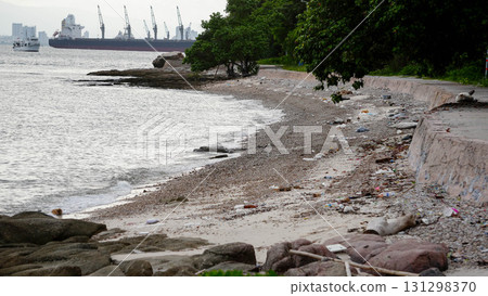 Sandy beach shoreline with calm sea. 131298370